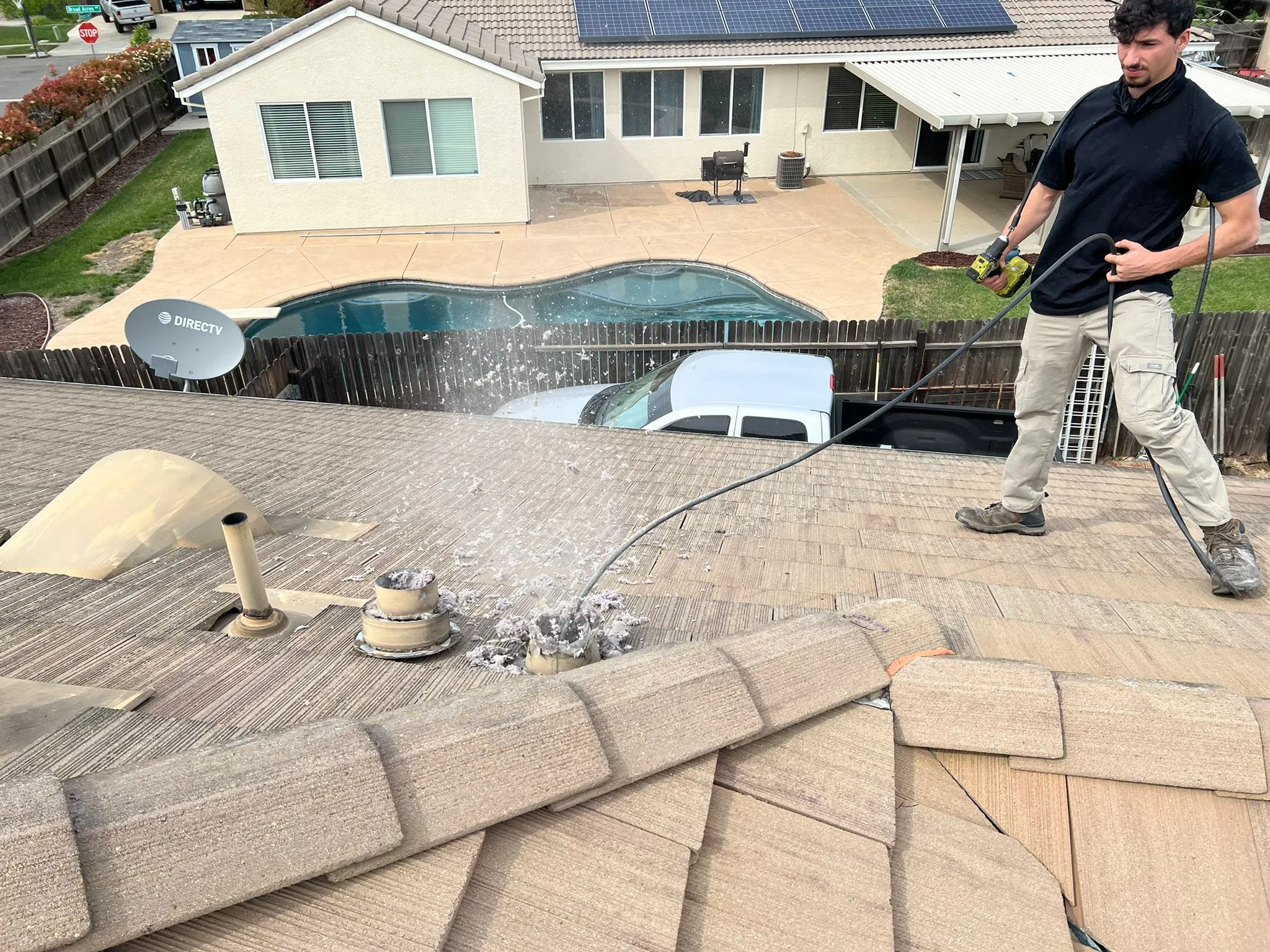 Technician performing dryer vent cleaning at a Roseville home